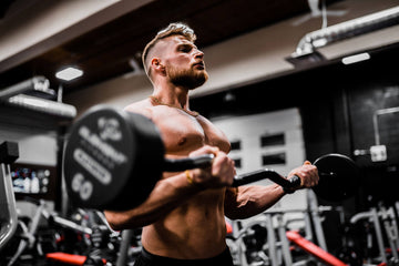 strong men lifting weight on the gym